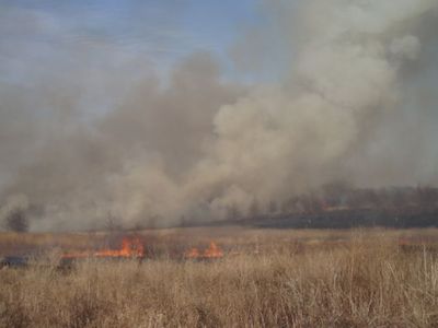 Smoke rises over the Prairie