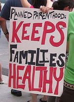 Planned Parenthood Keeps Families Healthy sign from photo by clockworknate on Flickr