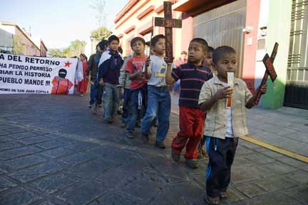 Indigenous Triqui children march through the streets of Oaxaca on December 19, 2011, to protest a wave of killihngs in their home community of San Juan Copala.