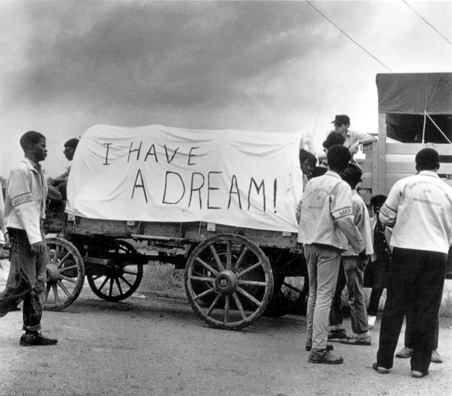 A mule train leaves for Washington during the May 1968 Poor People's March in this photograph by Ernest Withers.