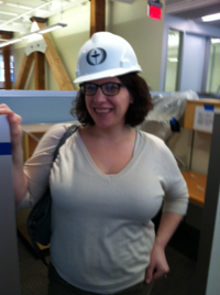 Alyssa Hassan, Senior Marketing Manager at Beacon Press, tours the new building during construction.