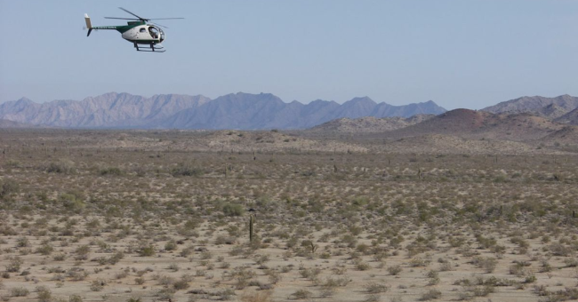 US Border Patrol helicopter over the Sonoran Desert
