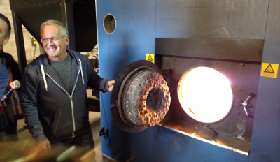 Søren Hermansen shows visitors the straw-fired furnace at Samsø’s Ballen-Brundby district heating plant.
