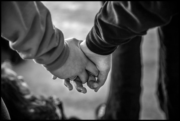 Holding hands is part of the vigil ritual