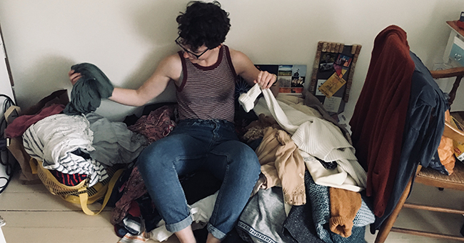 Ayla Zuraw-Friedland sorting her clothes piles