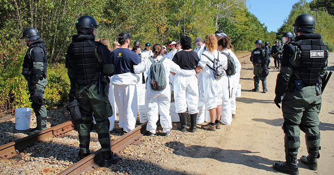 New Hampshire State Police in full riot gear arrest peaceful protesters with the grassroots #NoCoalNoGas campaign at Merrimack Station in Bow, NH, the last major coal-fired power plant in New England, on September 28, 2019. Sixty-seven were arrested, with hundreds more supporting. 