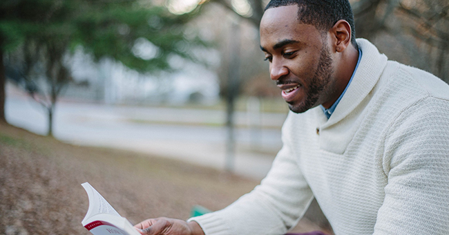 Black man reading