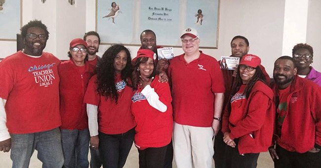 Brandon Johnson (far left) alongside other CTU members during the 2019 strike
